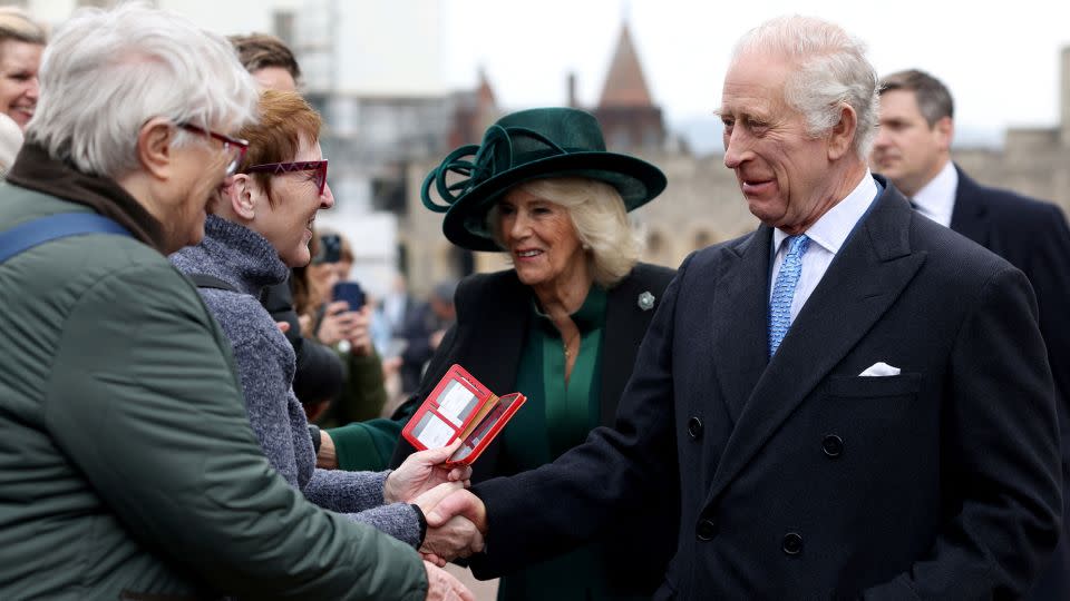 King Charles III and Queen Camilla greet people after attending the Easter Mattins Service at St. George's Chapel on March 31 in Windsor, England. - Hollie Adams/WPA Pool/Getty Images