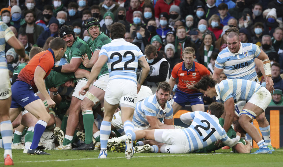 Ireland's Dan Sheehan, bottom right, scores try during the rugby union international match between Ireland and Argentina at the Aviva Stadium in Dublin, Ireland, Sunday, Nov. 21, 2021. (AP Photo/Peter Morrison)