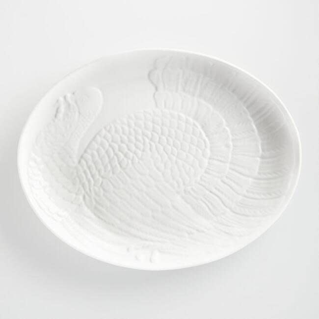 This <a href="https://www.worldmarket.com/product/white-oversized-turkey-platter.do?sortby=ourPicks&amp;from=Search" target="_blank">substantial turkey platter</a>&nbsp;accommodates everything from a Thanksgiving turkey to a Sunday roast.