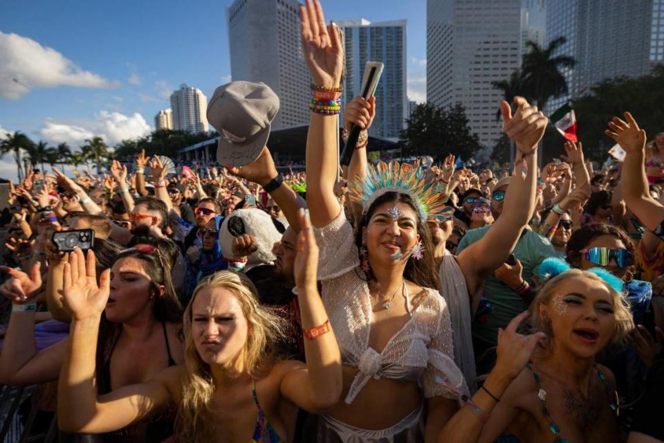 Karen Laverde, center, signs along to Aforjack’s set during Ultra Day 3 at the Main Stage on Sunday, March 24, 2024, at Bayfront Park in downtown Miami.