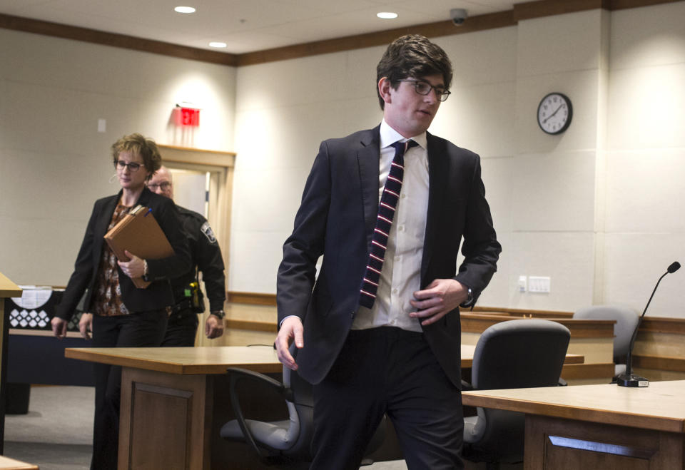 CORRECTS BYLINE TO GEOFF FORESTER, NOT ELIZABETH FRANTZ - Owen Labrie, followed by his attorney Jaye Rancourt, leaves Merrimack County Superior Court after his amended sentence hearing, Tuesday, Dec. 18, 2018, in Concord, N.H. A judge has refused to shorten the jail term for Labrie, a New Hampshire prep school graduate convicted of sexually assaulting a 15-year-old classmate in 2015, saying he has to report to jail for the remaining 10 months of his sentence the day after Christmas. (Geoff Forester/The Concord Monitor via AP, Pool)