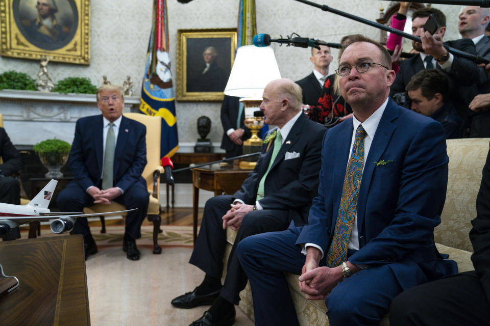 Former acting White House chief of staff Mick Mulvaney listens as President Donald Trump speaks during a meeting with Irish Prime Minister Leo Varadkar in the Oval Office of the White House, Thursday, March 12, 2020, in Washington. (AP Photo/Evan Vucci)