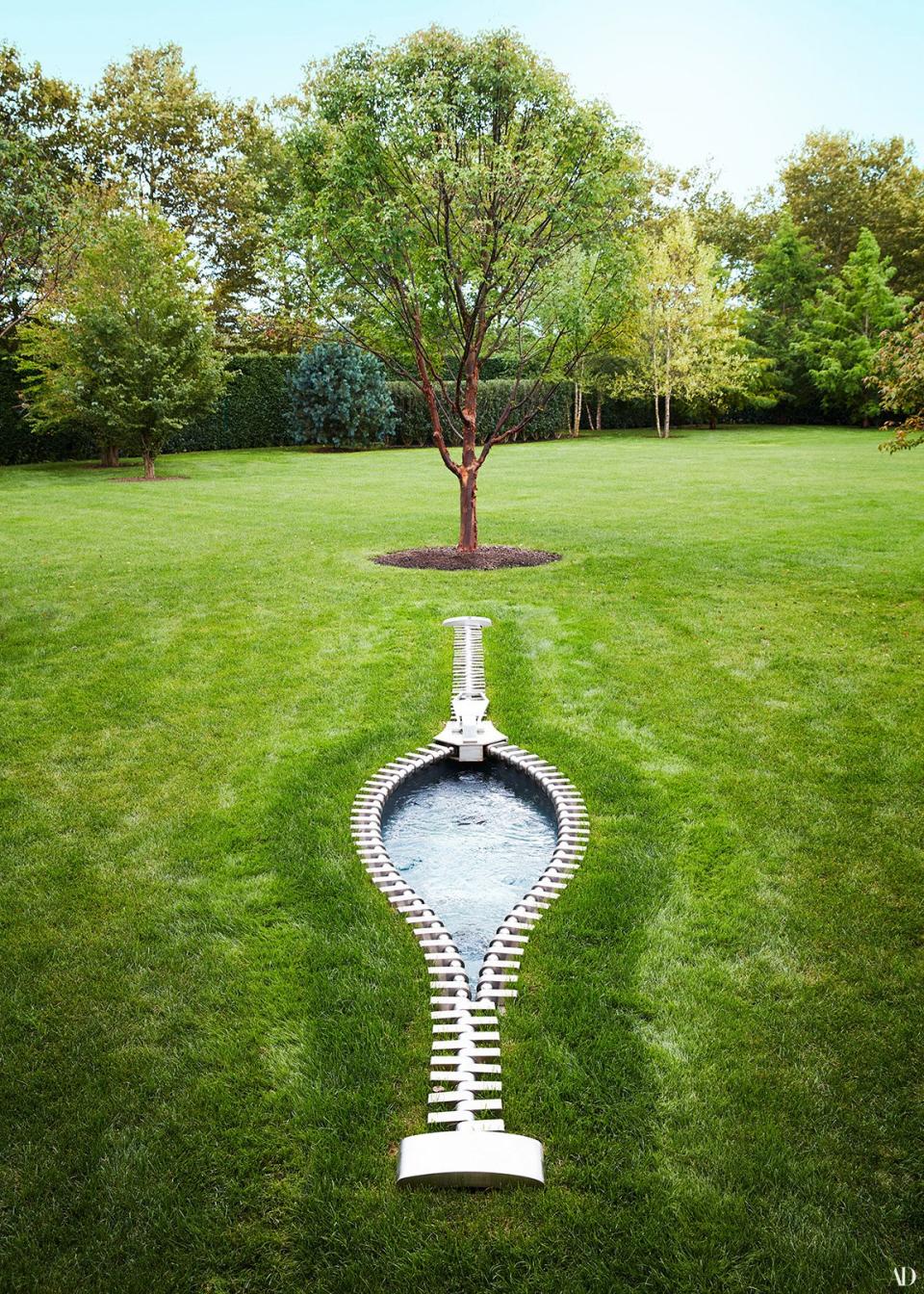 A zipper artwork by Mark Richard Hall in the garden.