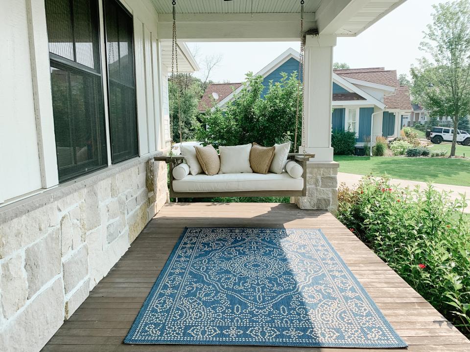 One of Weggemann’s favorite areas of the home is the wide porch, where she and her husband spend time with their dog, Sam. “I hope to sit here and watch our kids play in the yard one day,” she adds.
