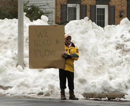 Mike Mazza stands outside of his subdivision attempting to get plow service for snowy streets in Gaithersburg, Maryland January 26, 2016. REUTERS/Gary Cameron