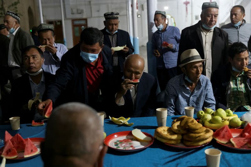 Muslims break their fast at Hotan Jiaman Mosque during the holy month of Ramadan in Hotan