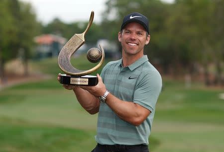 Mar 11, 2018; Palm Harbor, FL, USA; Paul Casey poses with the trophy after winning the Valspar Championship golf tournament at Innisbrook Resort - Copperhead Course. Jasen Vinlove-USA TODAY Sports