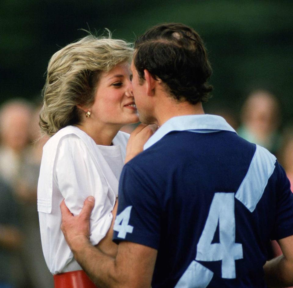 Prince Charles, Prince of Wales kisses Diana, Princess of Wales after she presents him with a prize at polo in Cirencester