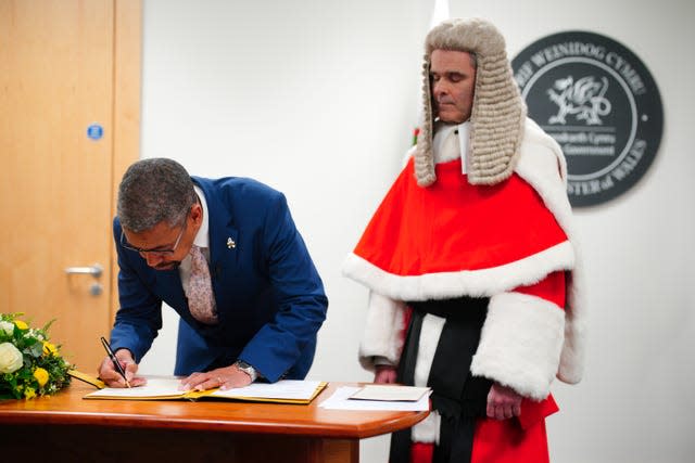 New First Minister of Wales Vaughan Gething signs his affirmation