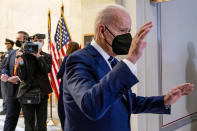 President Joe Biden reacts to a barrage of questions from members of the media as he leaves a meeting with the Senate Democratic Caucus to discuss voting rights and election integrity on Capitol Hill in Washington, Thursday, Jan. 13, 2022. (AP Photo/Andrew Harnik)