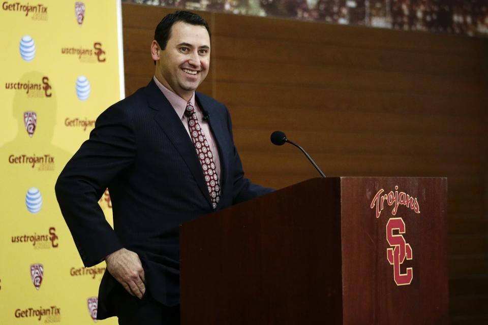 New USC football coach Steve Sarkisian smiles while talking to reporters during a news conference on Dec. 3, 2013.