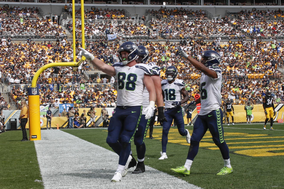 Seattle Seahawks tight end Will Dissly (88) celebrates with teammates after making a touchdown catch against the Pittsburgh Steelers in the second half of an NFL football game Sunday, Sept. 15, 2019, in Pittsburgh. (AP Photo/Don Wright)