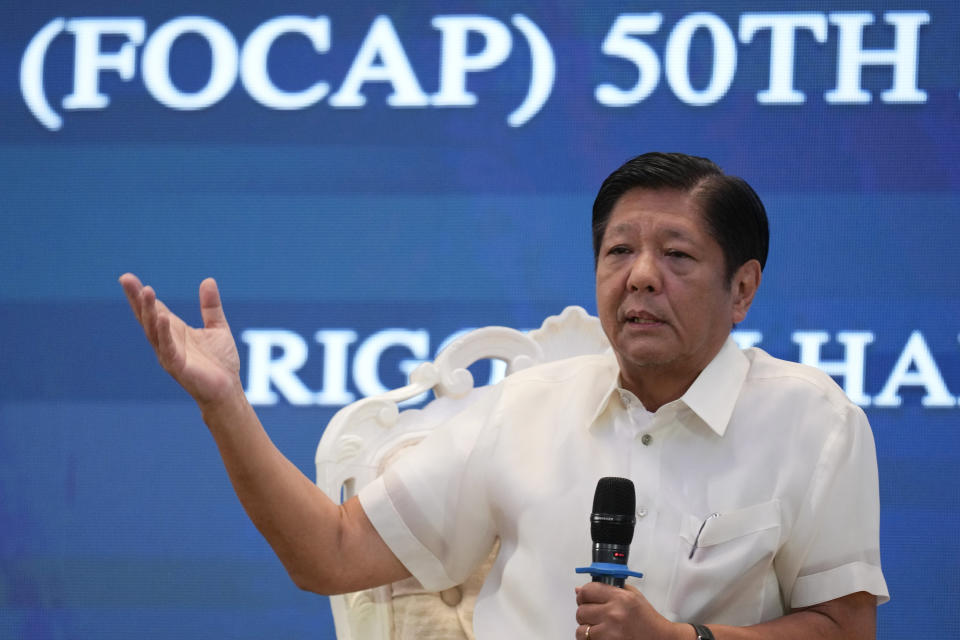 Philippine President Ferdinand Marcos Jr. gestures as he answers questions during a forum of the Foreign Correspondents Association of the Philippines on Monday, April 15, 2024, in Manila, Philippines. (AP Photo/Aaron Favila)