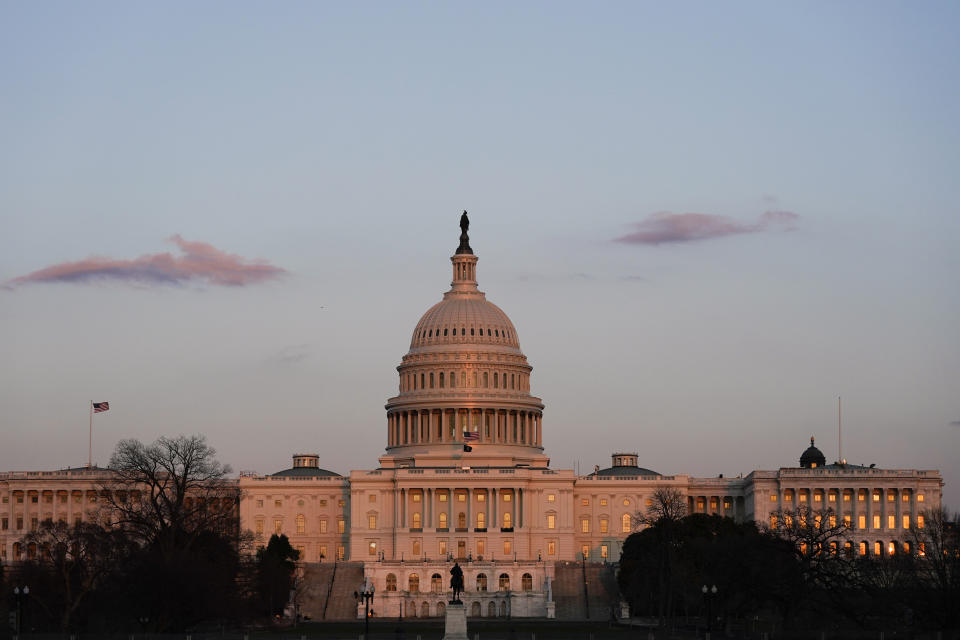 The sun sets on the U.S. Capitol building, Thursday, March 4, 2021, in Washington. (AP Photo/Alex Brandon)