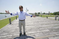 Resident Engineer Steve Sherrill, with the US Army Corps of Engineers, talks about the project to raise some of the levees and seawalls in the area Thursday, July 26, 2018, in Port Arthur, Texas. As the nation plans new defenses against the more powerful storms and higher tides expected from climate change, one project stands out: an ambitious proposal to build a nearly 60-mile “spine” of concrete seawalls, earthen barriers, floating gates and steel levees on the Texas Gulf Coast.(AP Photo/David J. Phillip)