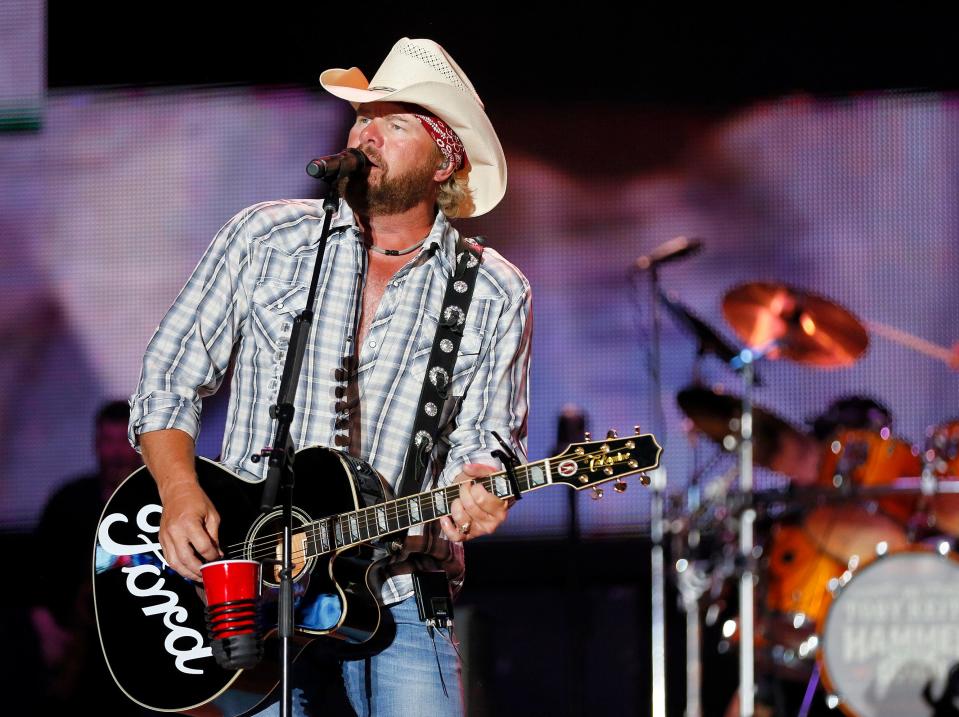 Toby Keith performs at the end of the Oklahoma Twister Relief Concert, benefiting victims of the May tornadoes, at Gaylord Family - Oklahoma Memorial Stadium on the campus of the University of Oklahoma in Norman, Okla., Saturday, July 6, 2013. Photo by Nate Billings, The Oklahoman