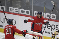 Washington Capitals left wing Carl Hagelin (62) celebrates his goal with right wing Garnet Hathaway (21) during the second period of an NHL hockey game against the Boston Bruins, Tuesday, May 11, 2021, in Washington. (AP Photo/Nick Wass)