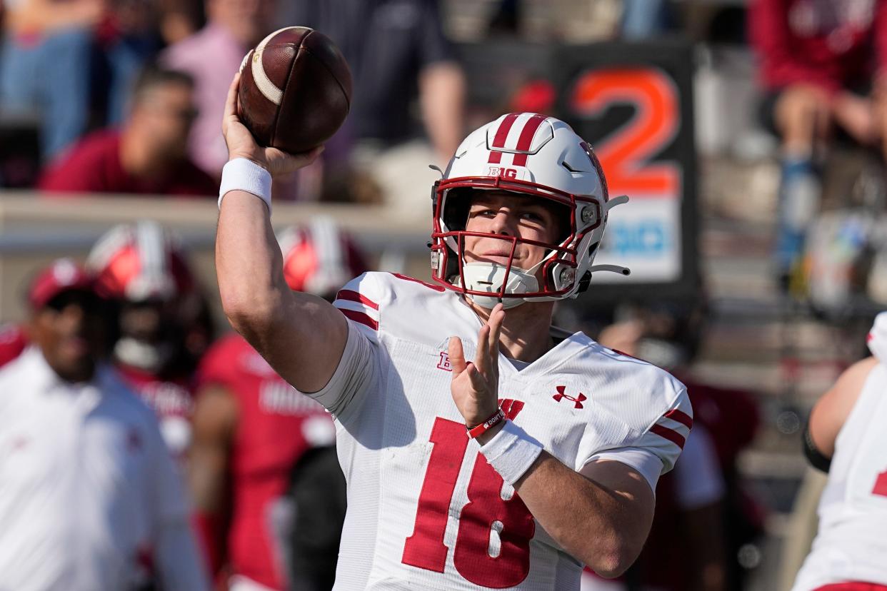 Wisconsin quarterback Braedyn Locke throws during the first half of an NCAA college football game against Indiana, Saturday, Nov. 4, 2023, in Bloomington, Ind. (AP Photo/Darron Cummings)