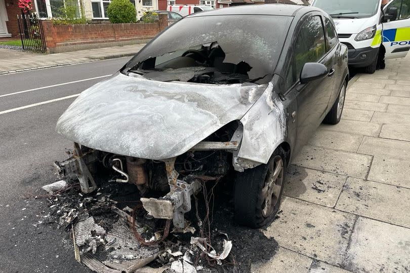 The remains of the torched Vauxhall Corsa on Caledonian Road