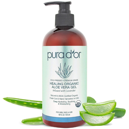 Pura d'Or Aloe VEra Gel against white background with aloe vera leaves behind and in front of bottle