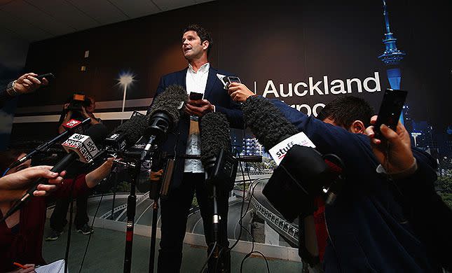 Chris Cairns defending his innoncence at Auckland Airport in May. Getty Images.