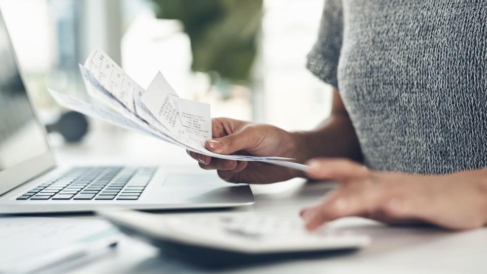 Person paying bills at computer