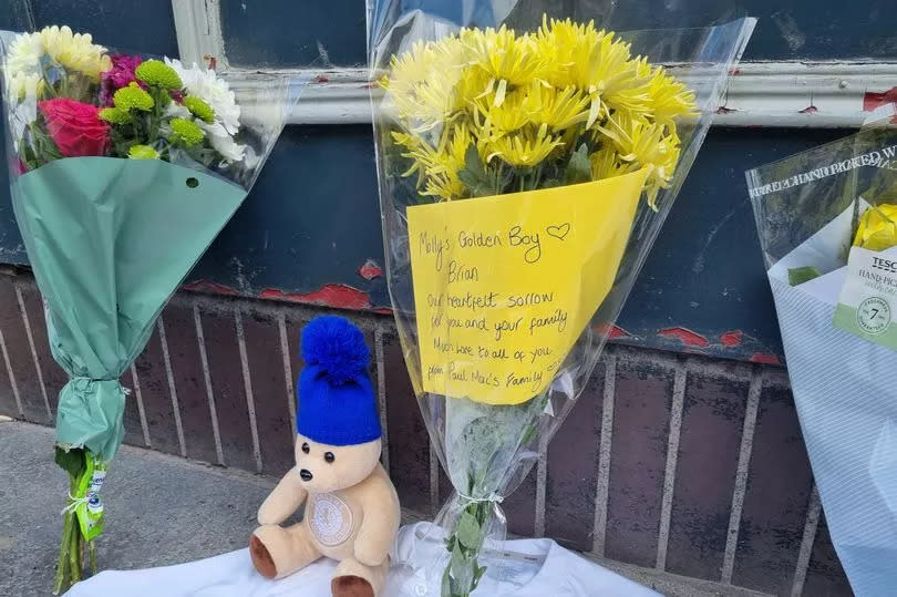 Floral tributes at the scene.