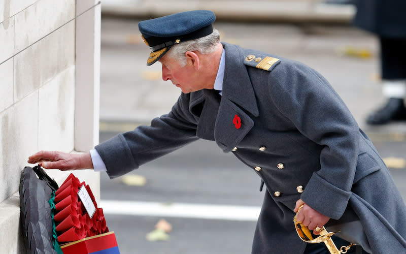 Prince Charles lays a wreath at a memorial monument in London on November 12, 2017, on behalf of Queen Elizabeth, who normally performs this duty herself. Photo from Getty Images.