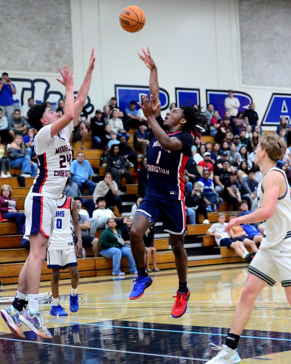 Modesto Christian guard Jeremiah Bernard (1) makes the game winning shot during the 27th Annual Six County All Star Senior Basketball Classic Boys game at Modesto Junior College in Modesto California on April 27, 2024. The Red team beat the Blue team 81-79.