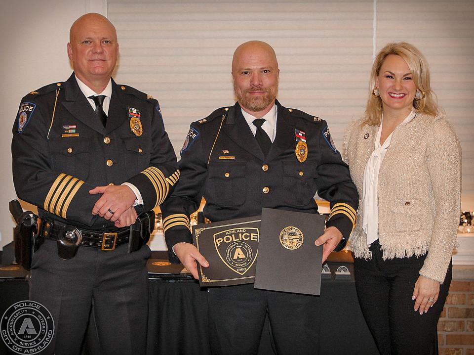20 Years of Service L to R; Chief David Lay, Captain Craig Kiley, State Rep. Melanie Miller