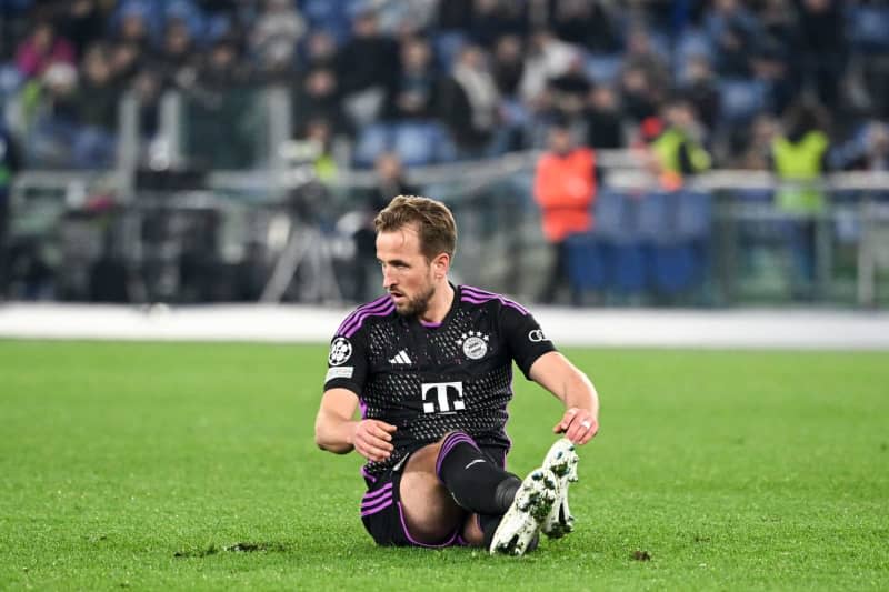 Bayern Munich's Harry Kane sits on the pitch during the UEFA Champions League round of 16 first leg soccer match between Lazio Roma and Bayern Munich at the Olympic Stadium. Sven Hoppe/dpa
