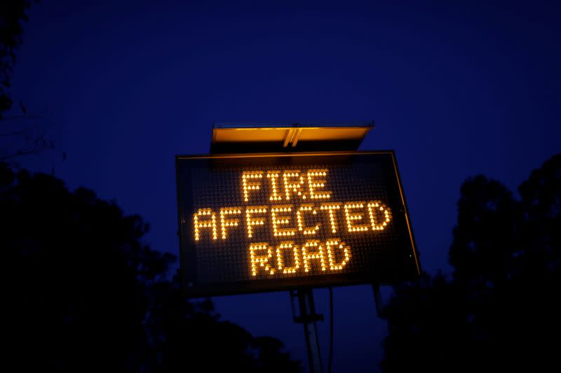 Signage is seen on the bushfire affected Bruthen-Buchan Road near Buchan, Victoria, Australia