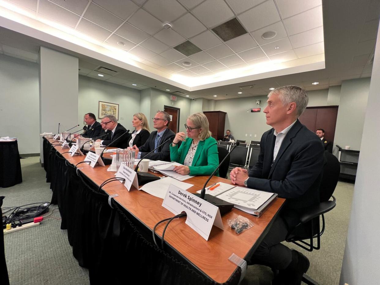 Derek Spinney, sitting at the right end of the table, is vice-president of corporate services at Nova Scotia Health. (Jean Laroche/CBC - image credit)