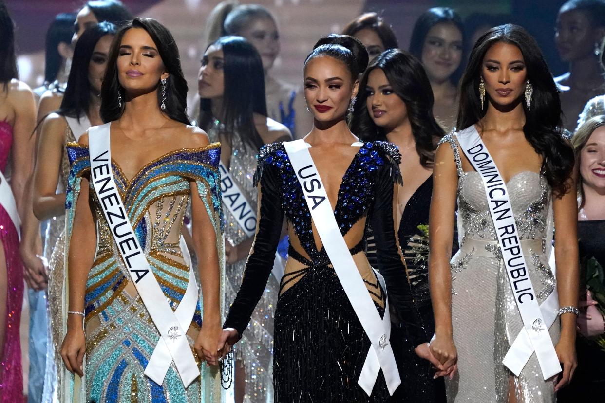 From left: Miss Venezuela Amanda Dudamel, Miss USA R'Bonney Gabriel and Miss Dominican Republic Andreina Martinez hold hands before the final verdict in 2023.