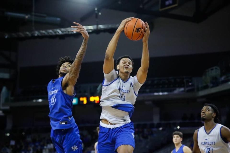 Tre Mitchell grabs a rebound against teammate Jordan Burks during the Kentucky basketball Blue-White Game on Saturday night.