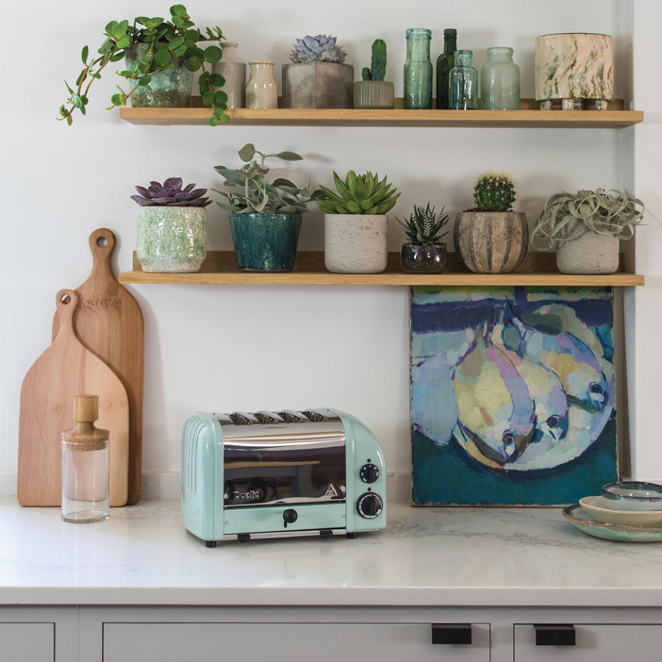 kitchen room with toaster and wooden shelves