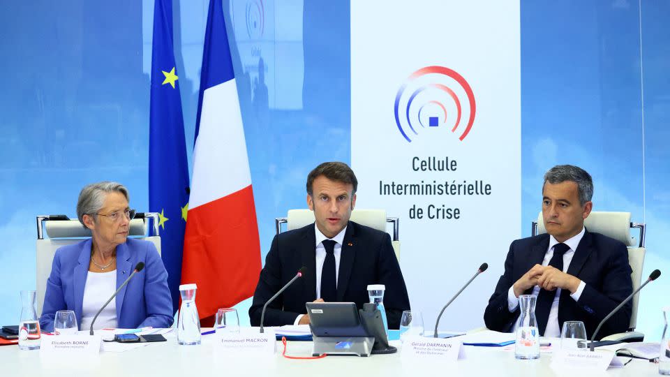 French President Emmanuel Macron (center) held a crisis meeting, in Paris, on Friday, after the police shooting of a teenage boy triggered protests. - Yves Herman/AFP/Getty Images