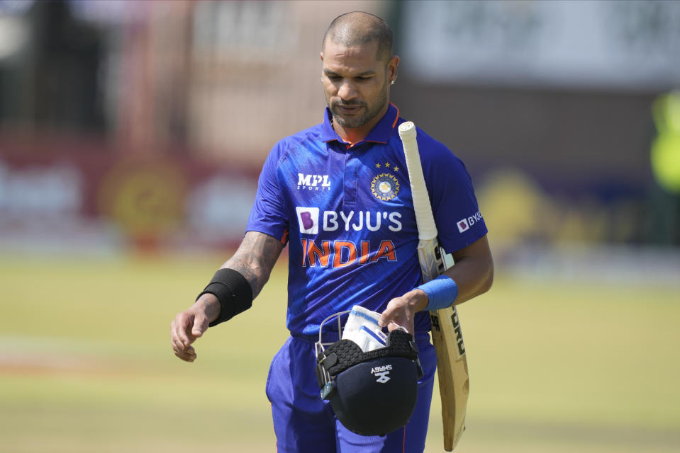 Indian batsman Shikhar Dhawan walks off the pitch after been dismissed on the last day of the One-Day International cricket match between Zimbabwe and India at Harare Sports Club in Harare, Zimbabwe, Monday, Aug, 22, 2022. (AP Photo/Tsvangirayi Mukwazhi)