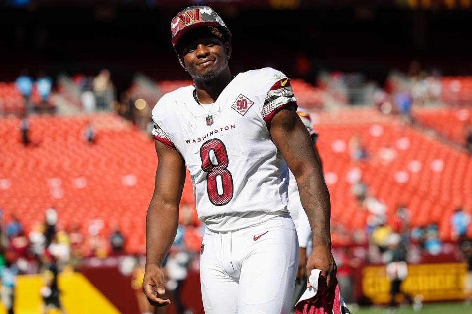 Brian Robinson #8 of the Washington Commanders looks on after the preseason game against the Carolina Panther