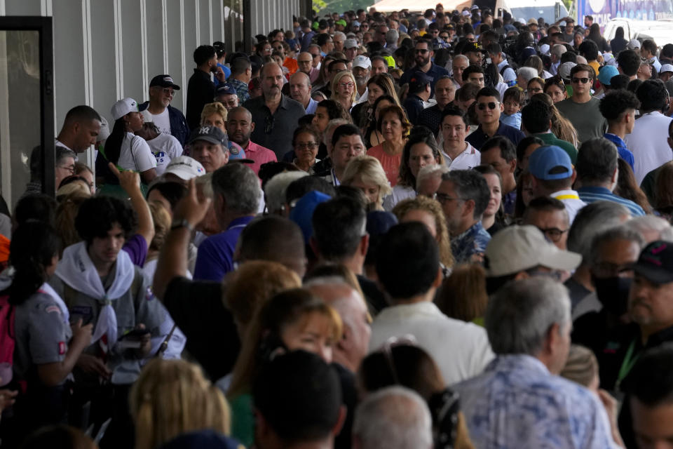 Voters gather outside a polling station during a general election in Panama City, Sunday, May 5, 2024. (AP Photo/Matias Delacroix)