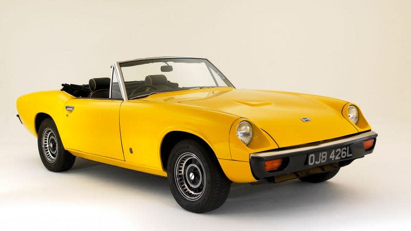 A photo of a yellow Jensen Healey sports car. 