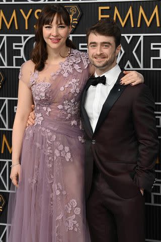 <p>emmys-2023-couples-011524David Fisher/Shutterstock</p> Daniel Radcliffe and Erin Darke attend the 75th Primetime Emmy Awards