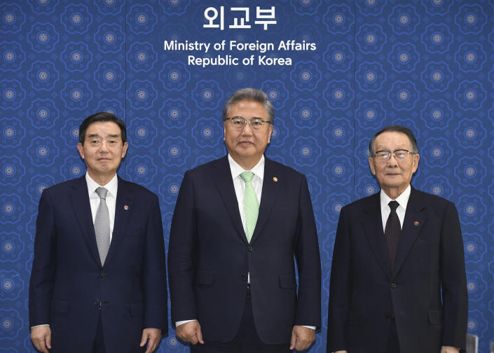 South Korean Foreign Minister Park Jin, center, poses for a photo with Mikio Sasaki, chairman of the Japan-Korea Economic Association, right, and Kim Yoon, chairman of the Korea-Japan Economic Association, left, ahead of their meeting at the Foreign Ministry in Seoul, South Korea, Monday, May 15, 2023. (Kim Min-Hee/Pool Photo via AP)