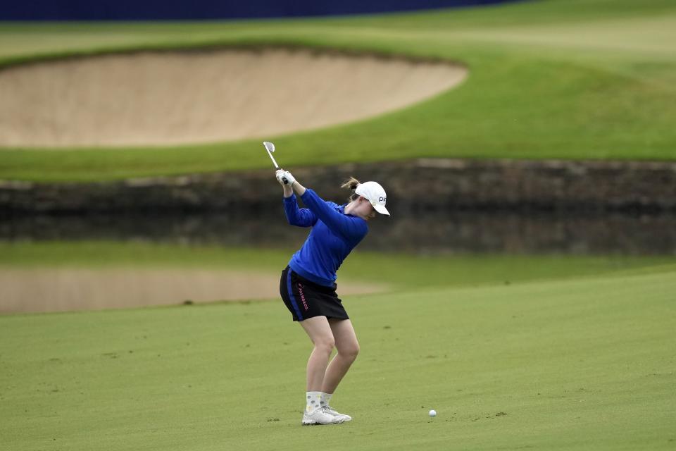 Karis Anne Davidson hits her approach shot to the 18th green during the first round of The Chevron Championship golf tournament Thursday, April 20, 2023, in The Woodlands, Texas. (AP Photo/David J. Phillip)