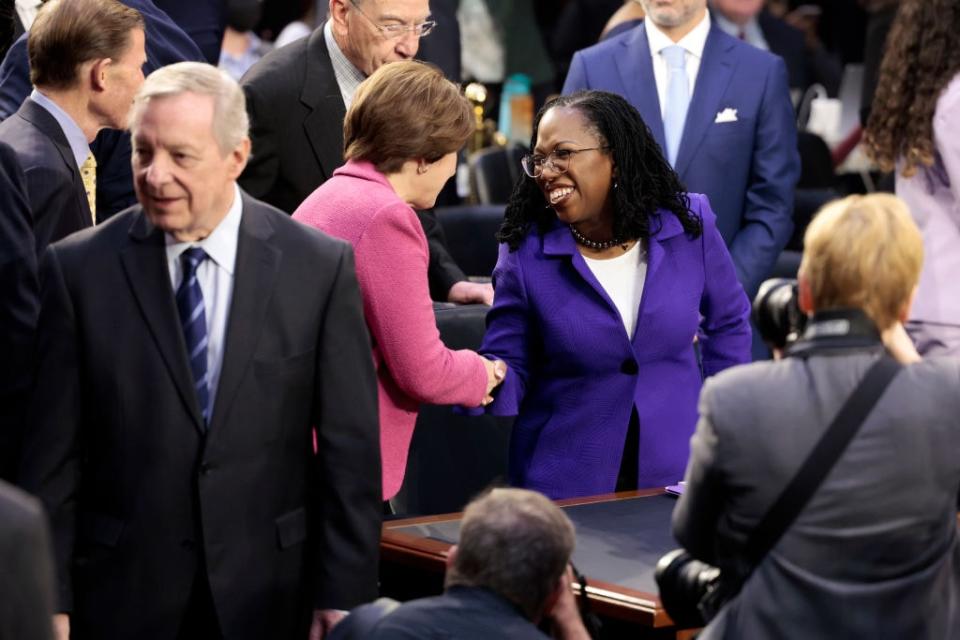 Sen. Amy Klobuchar (D-MD) (L) shakes hands with U.S. Supreme Court nominee Judge Ketanji Brown Jackson during her confirmation hearing before the Senate Judiciary Committee in the Hart Senate Office Building on Capitol Hill March 21, 2022 in Washington, DC. (Photo by Anna Moneymaker/Getty Images)