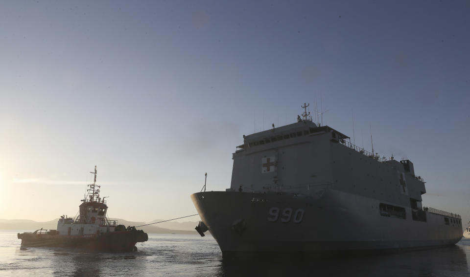 FILE - Indonesia navy hospital ship KRI Dr. Soeharso, right, sails to join the search for submarine KRI Nanggala that went missing while participating in a training exercise on Wednesday, off Banyuwangi, East Java, Indonesia, Saturday, April 24, 2021. The KRI Nanggala 402 went missing after its last reported dive off the resort island. An underwater robot equipped with cameras found the lost submarine lying in at least three pieces on the ocean floor at a depth of 838 meters (2,750 feet). All 53 crew members died. (AP Photo/Achmad Ibrahim)