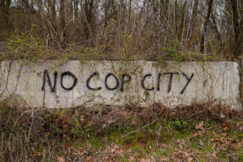 Graffiti is seen at the edge of Weelaunee People's Park, the planned site of a controversial 