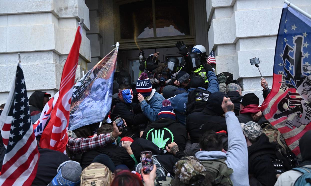 <span>Trump supporters clash with police on January 6.</span><span>Photograph: Brendan Smialowski/AFP/Getty</span>