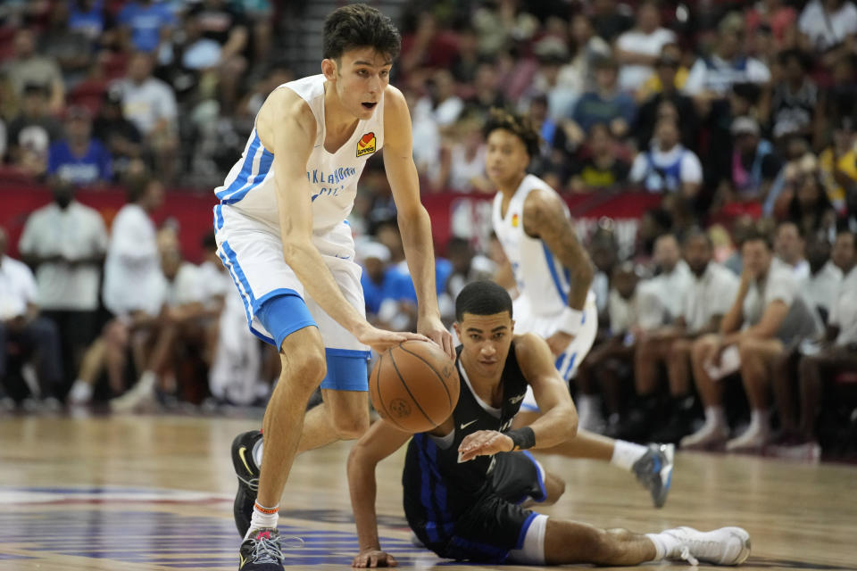 Oklahoma City Thunder's Chet Holmgren drives up the court against the Orlando Magic during the first half an NBA summer league basketball game Monday, July 11, 2022, in Las Vegas. (AP Photo/John Locher)