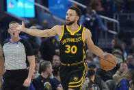 Golden State Warriors guard Stephen Curry (30) brings the ball upcourt against the Detroit Pistons during the first half of an NBA basketball game in San Francisco, Friday, Jan. 5, 2024. (AP Photo/Jeff Chiu)